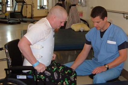 The Body Before and After Injury Doctor attending man in a wheelchair