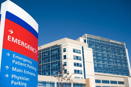 Front entrance of a hospital showing Emergency sign