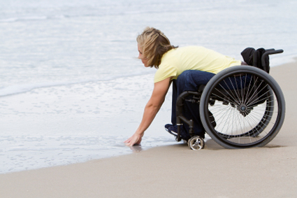 woman on wheelchair at the beach