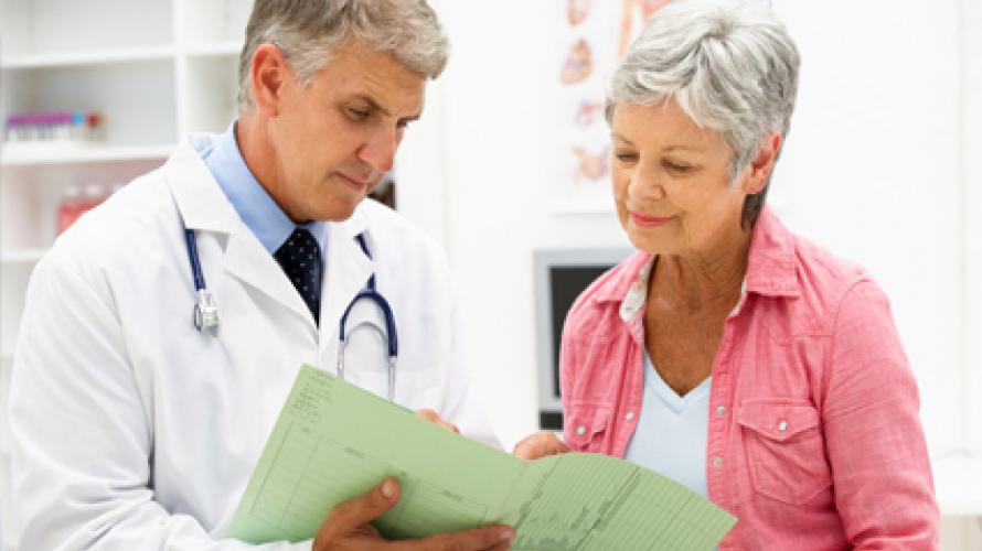 Doctor going over chart with patient 