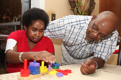 Brain Injury Impact on Individuals’ Functioning Father teaching daughter blocks